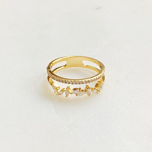 Colette Jeweled Ring flat lay of gold band with sparkling cubic zirconia accents