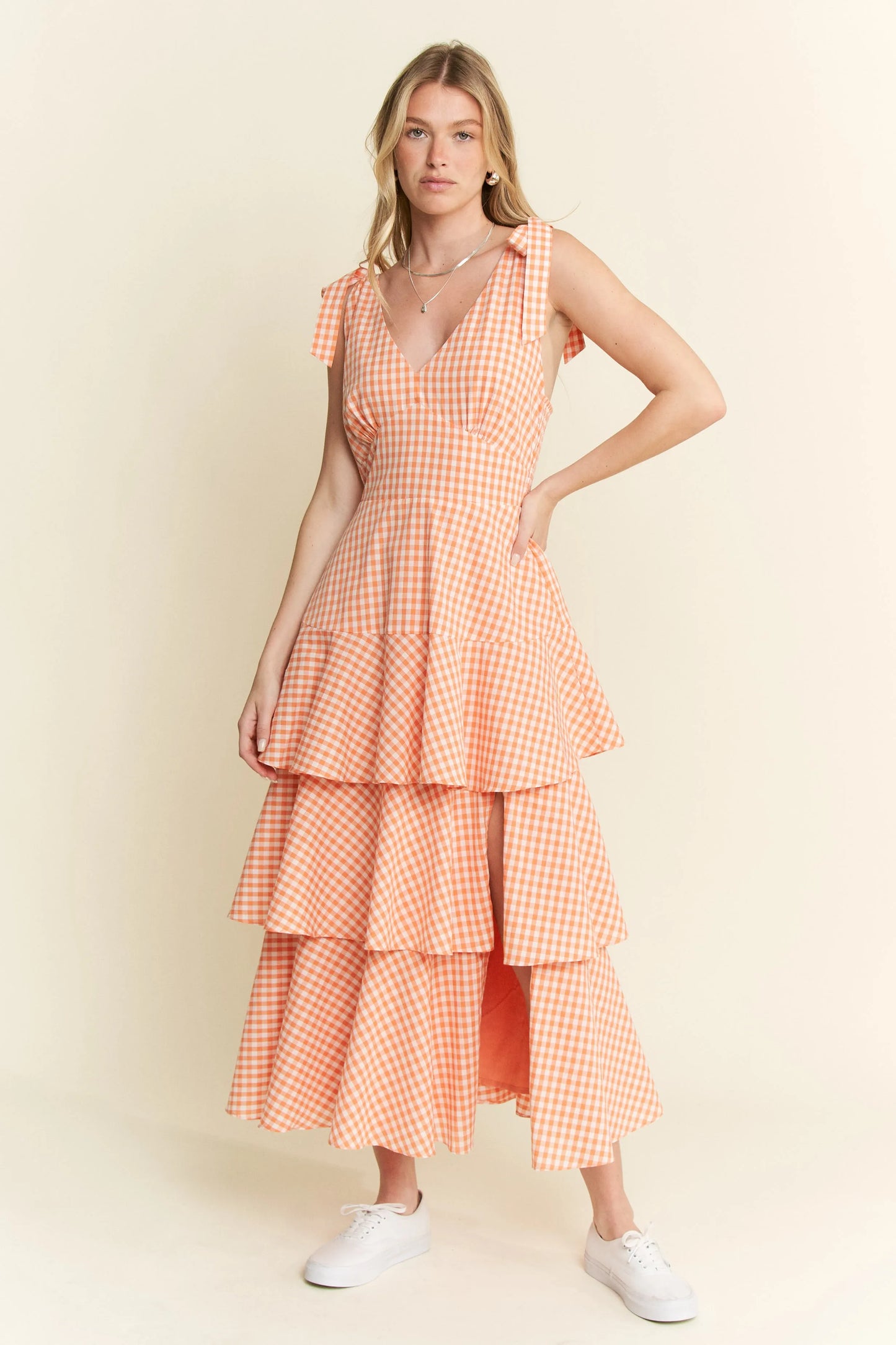 Front view of Alice Gingham Tiered Midi Dress by Jade by Jane, showing halter neckline, tiered ruffle layers, and cheerful orange gingham pattern.