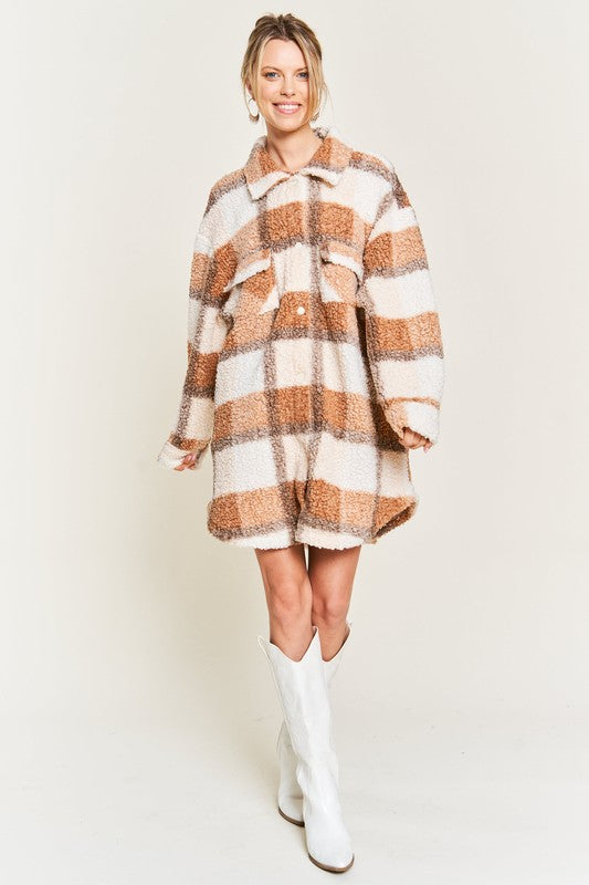 Full body front view of Sariya Plus Size Teddy Jacket in brown plaid styled with white boots.