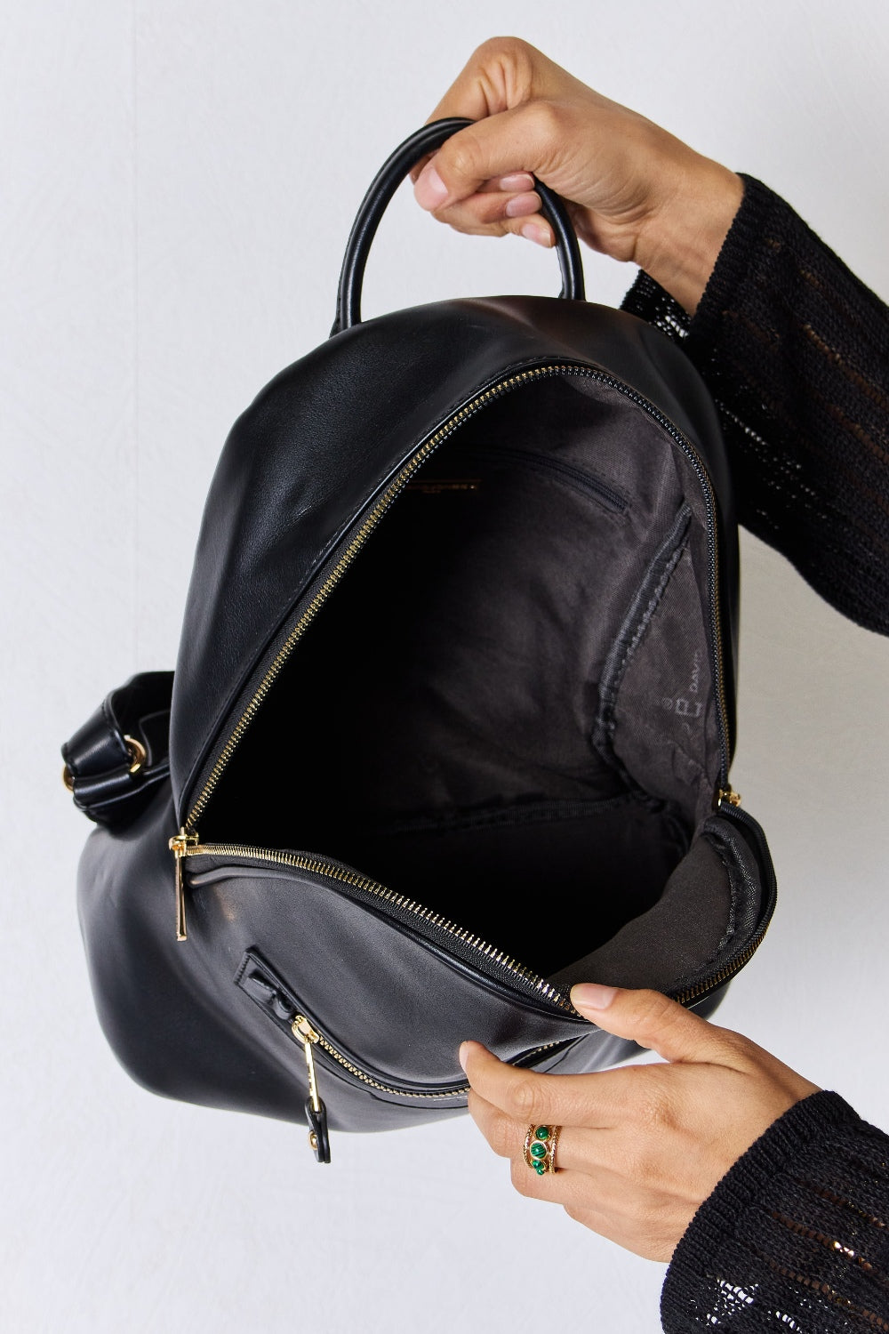Open interior of Garris backpack showing roomy compartments and organizational pockets.