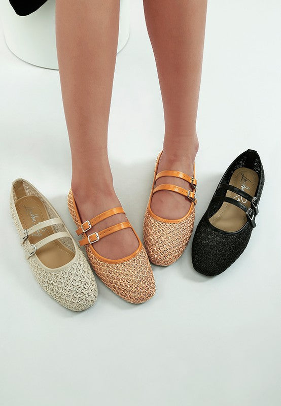 Model wearing Warena Ballerinas in tan, with beige and black shoes on either side.