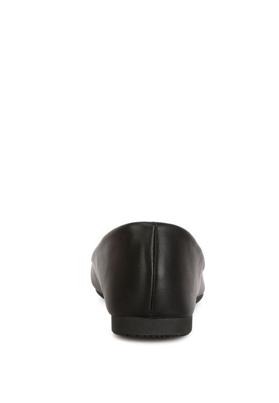 Back view of black ballet flats highlighting slip-on design