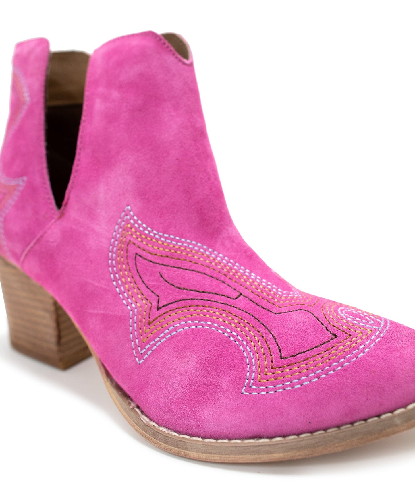 Close-up of Journee Magenta Suede Ankle Boots showing suede texture, stitching, and cutout design.