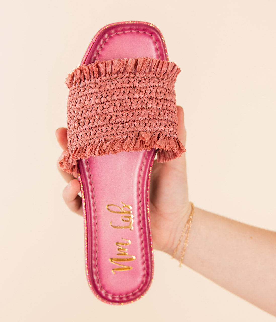 uana Pink Woven Slide Sandals with textured woven upper, leather footbed, and glitter trim border.