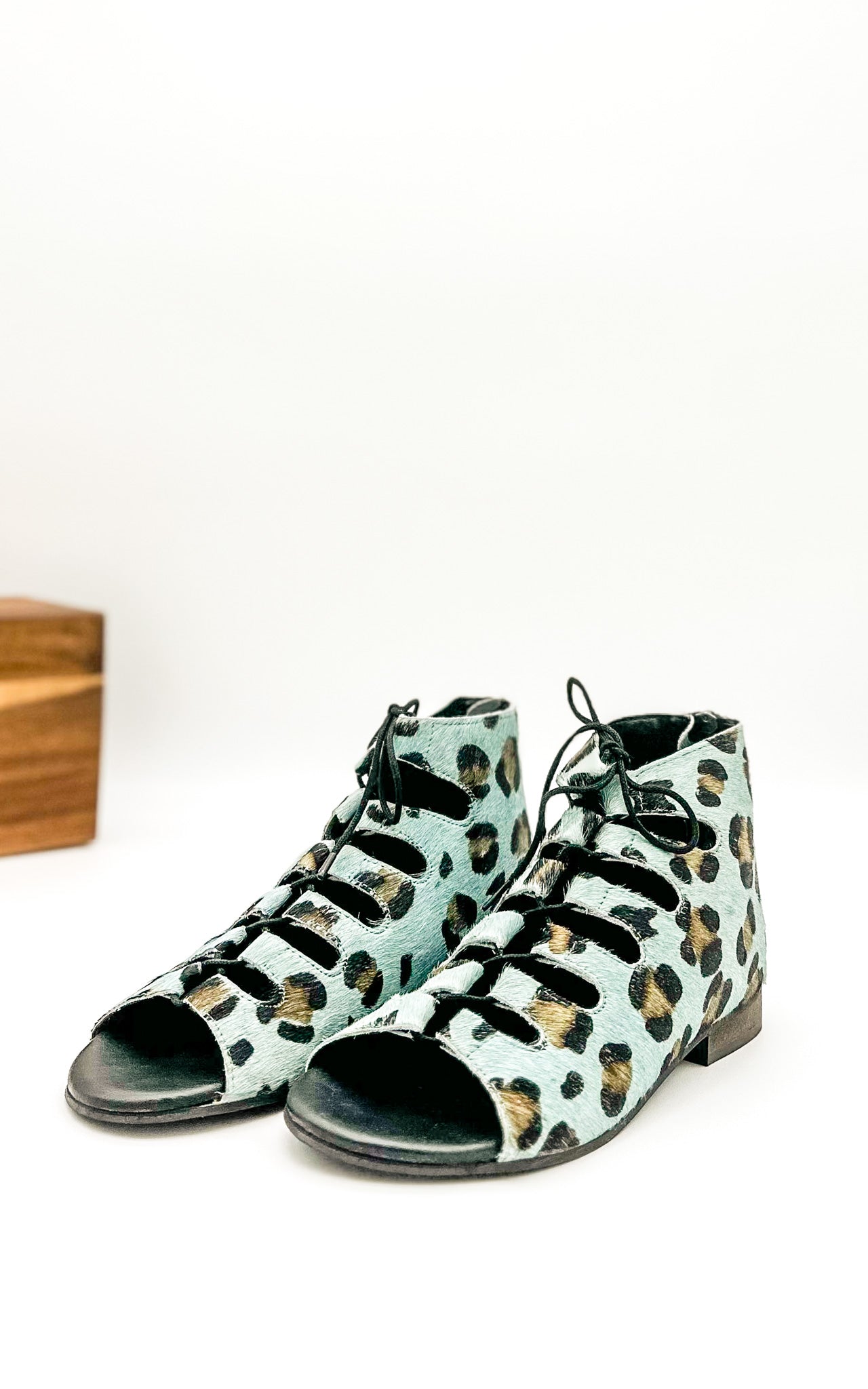 Front angle view of Nola Teal Leopard Sandals showing bold teal leopard print straps