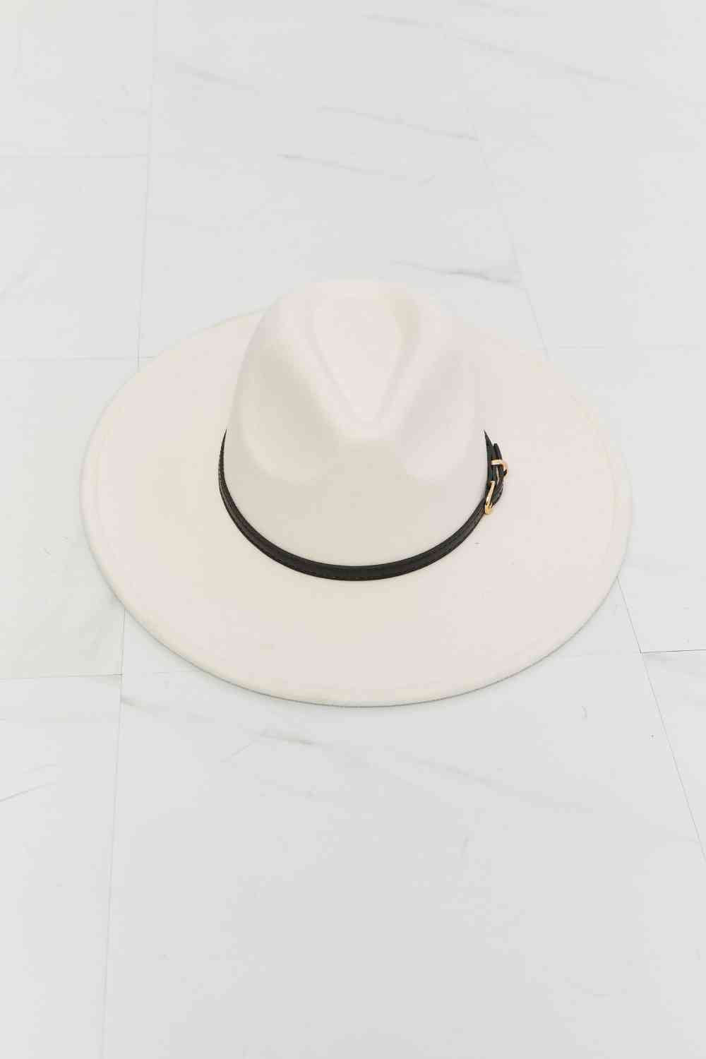Beige fedora hat with a wide brim, a thin black belt detail with gold hardware, and adjustable straps for a customizable fit.