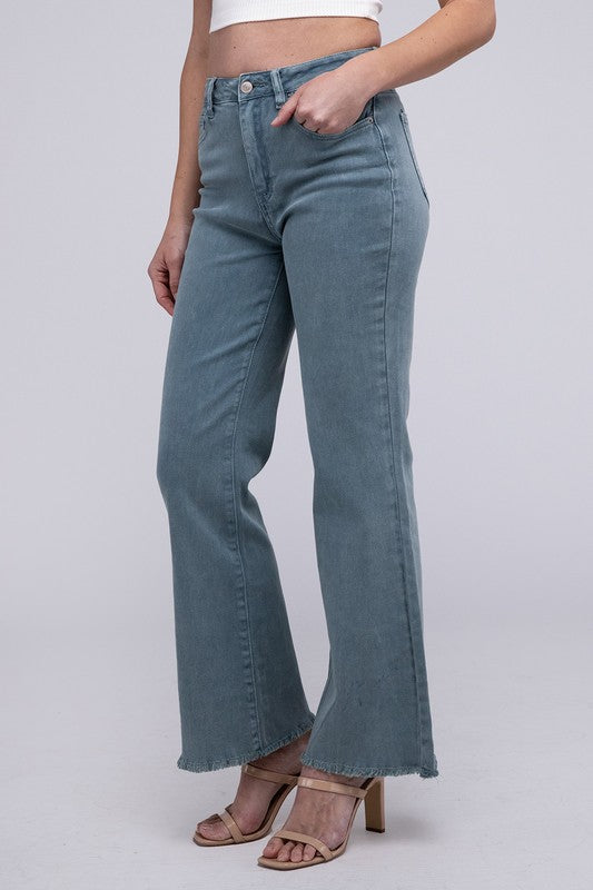 Teal acid-washed straight wide-leg pants featuring a frayed cutoff hem, zip fly closure, and a relaxed fit. Made with stretchy fabric for comfort and a unique vintage-inspired look.