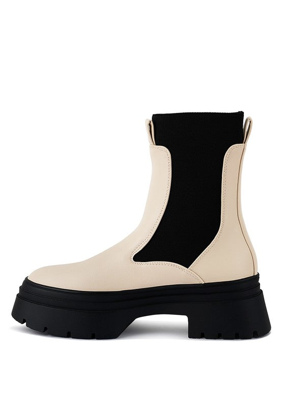 Ecru faux leather Chelsea boot with black gusset and bold platform sole.