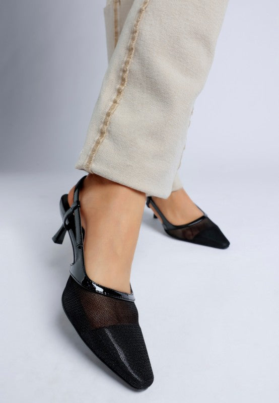 Model wearing Florina Mesh Slingback Heels paired with beige pants, highlighting toe design