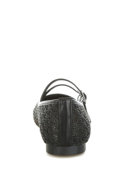 Back view of Warena Ballerinas in black, flat heel with raffia and faux leather finish