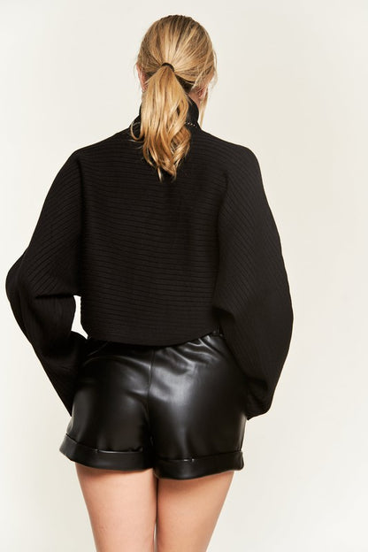 Back view Giada Mock Neck Wide Sleeves Sweater in black showing wide sleeves.