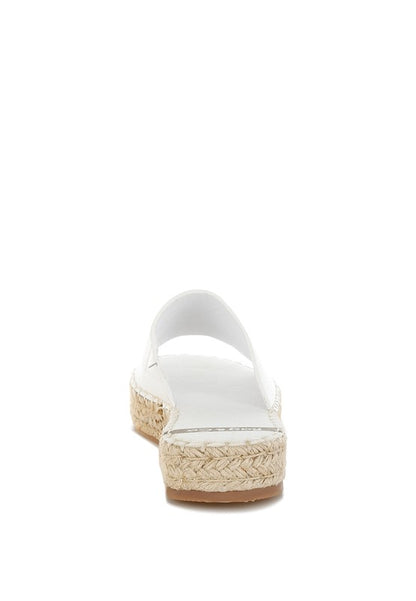 Back view of Scalar White Leather Flatforms showing jute-wrapped flatform heel and slip-on opening.