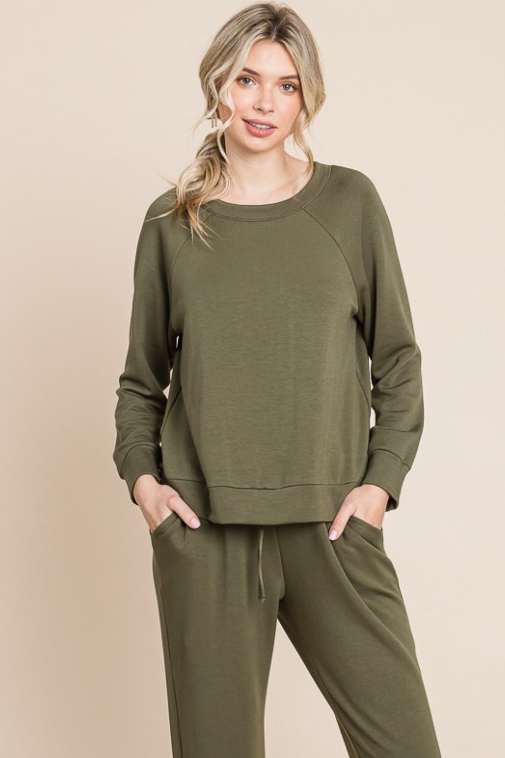 Olive lounge set with a round-neck top, raglan sleeves, and drawstring pants.