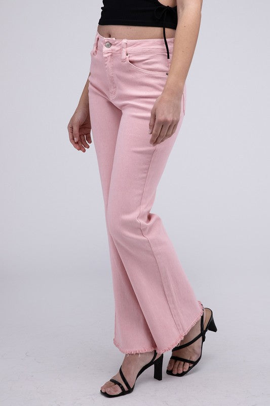 Pink acid-washed straight wide-leg pants featuring a frayed cutoff hem, zip fly closure, and a relaxed fit. Made with stretchy fabric for comfort and a unique vintage-inspired look.