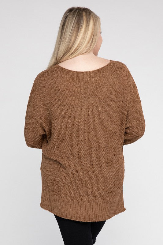 Coco plus size crew neck sweater with a loose fit, side slits, long sleeves, and a cozy knit fabric for warmth.