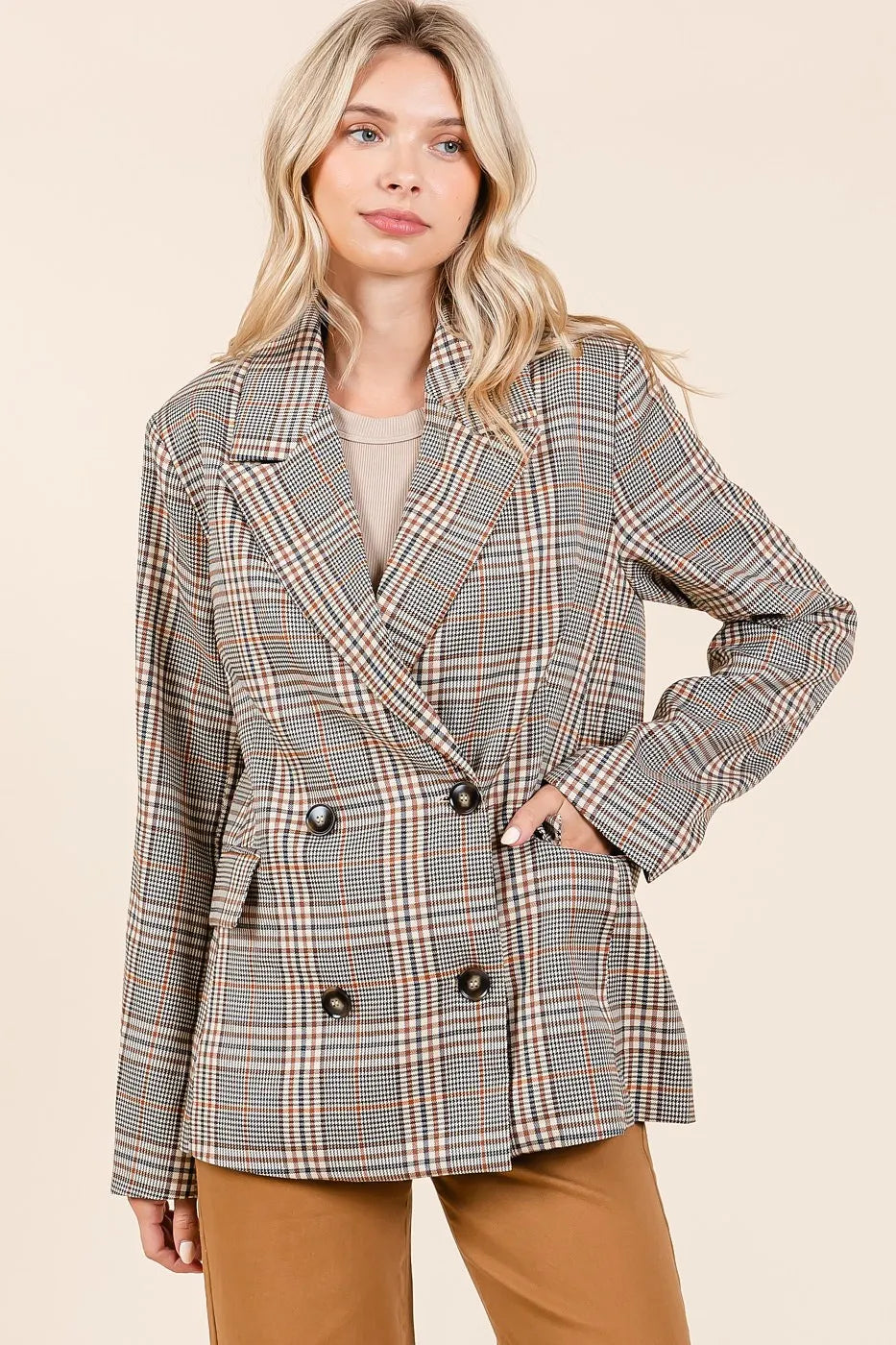 Front view of model wearing the Lennon Plaid Blazer buttoned up with brown jeans