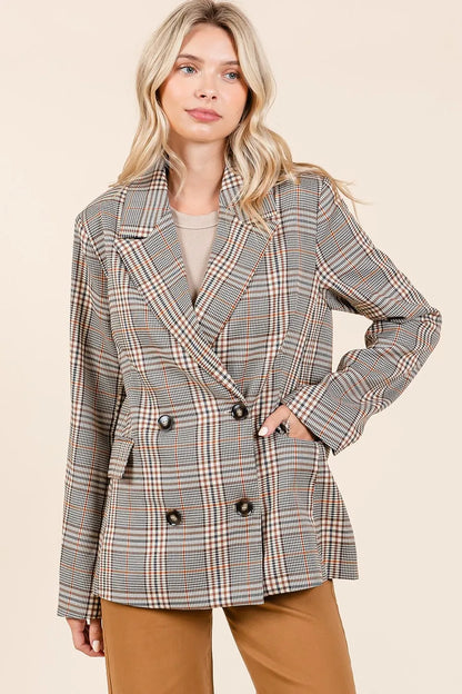 Front view of model wearing the Lennon Plaid Blazer buttoned up with brown jeans
