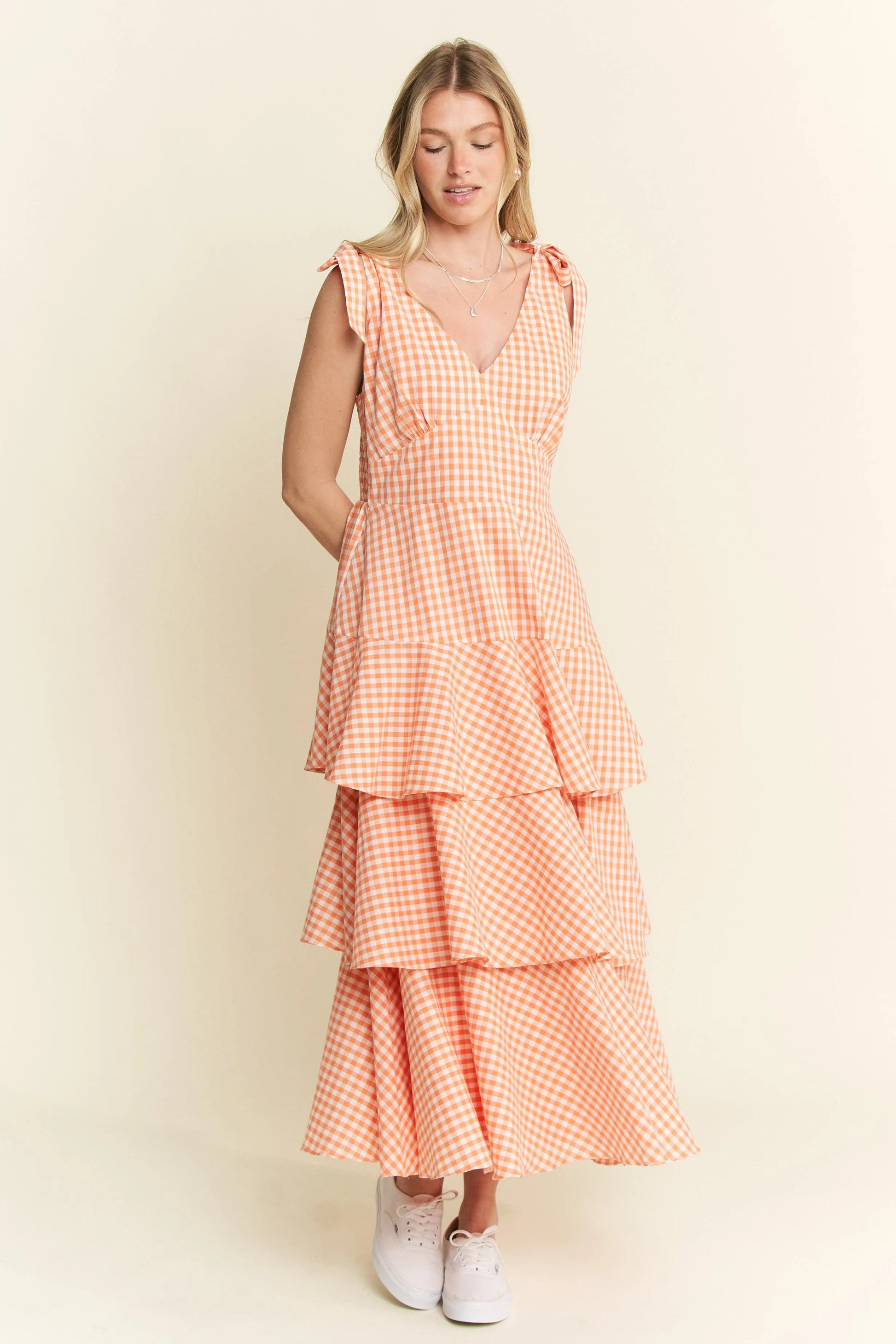 Full body front view of Alice Gingham Tiered Midi Dress by Jade by Jane, showcasing all three ruffled tiers, halter neckline, and orange gingham print.
