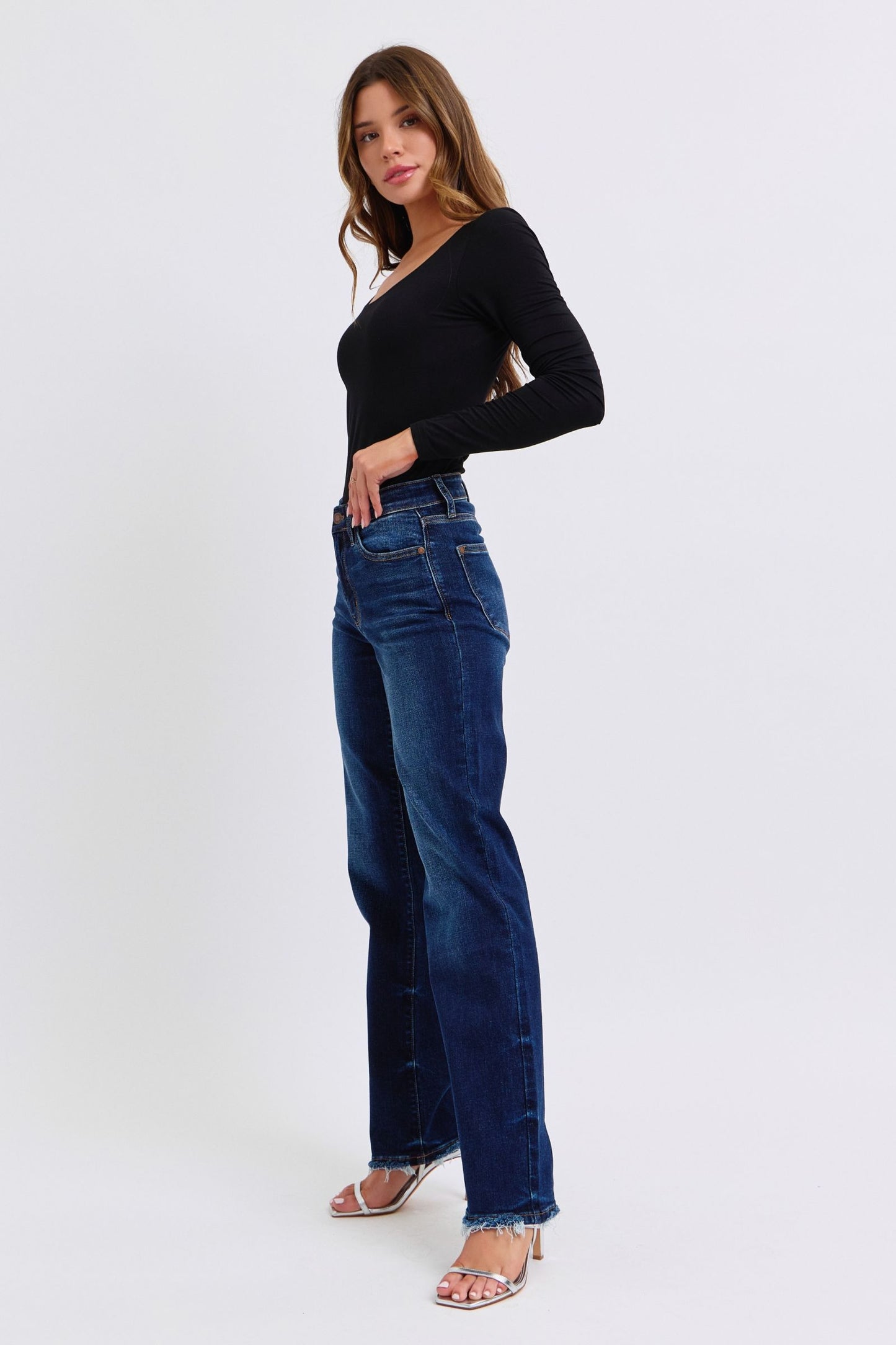 Judy Blue Polly Raw Hem Straight Leg Jeans in dark wash, featuring a mid-rise waist, raw hem, and slightly stretchy fit for a versatile, stylish look.