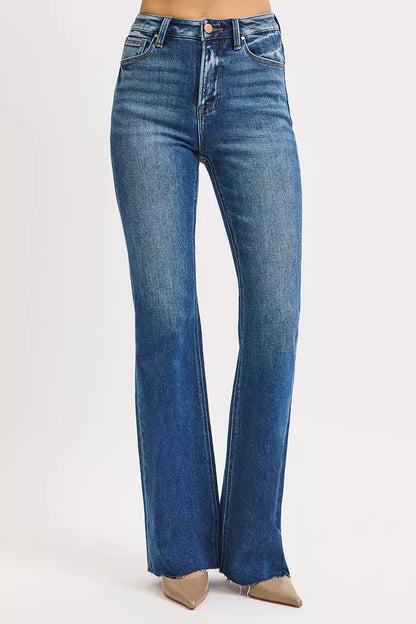 Model standing in Seraphina High Rise Flare Jeans, trendy dark wash flare style.