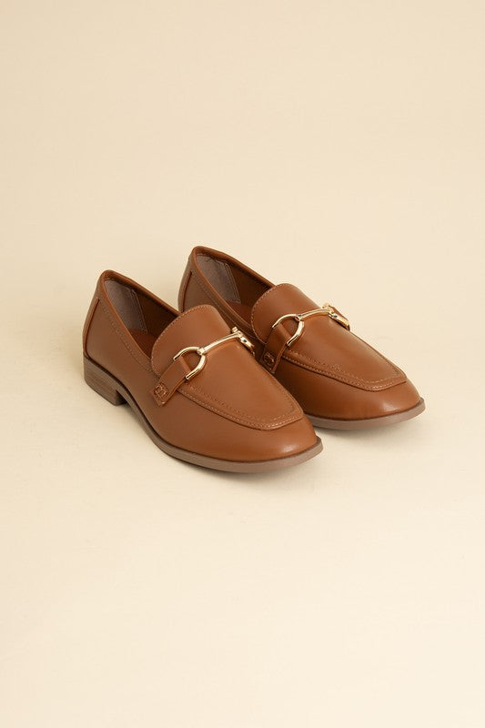 Cognac Horsebit Loafers with guitar motif, featuring horsebit detailing, slip-on style, and flat heel.