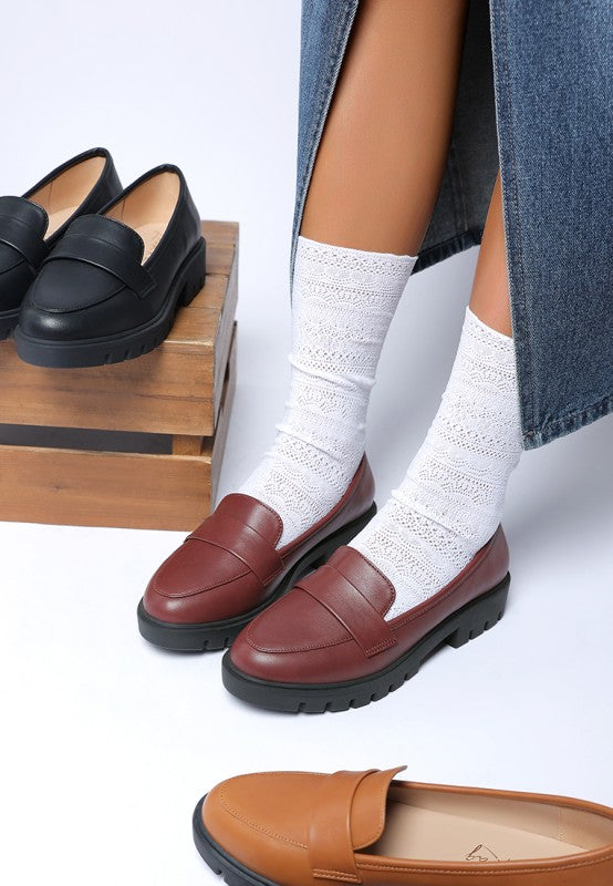 Peridot Chunky Loafers in burgundy with black and tan pairs beside, showing platform heel and sleek design.