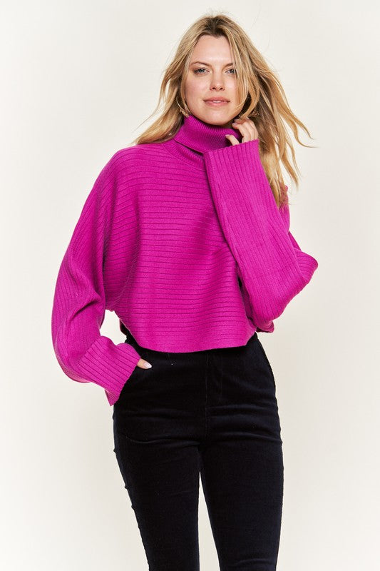 Front view Giada Plus Size Mock Neck Wide Sleeves Sweater in fuchsia, ribbed knit.