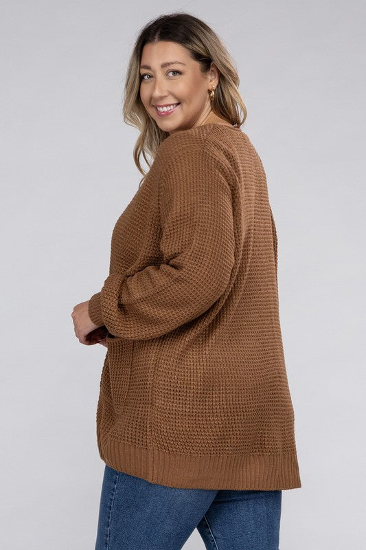 Curvy plus-size waffle-pattern open cardigan sweater in deep camel, with long sleeves, oversized fit, and pockets.