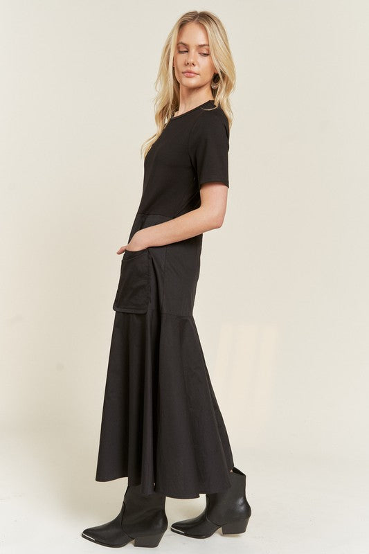 Side view of Felicity Knit Mix Dress in black showing flowy skirt and patch pockets