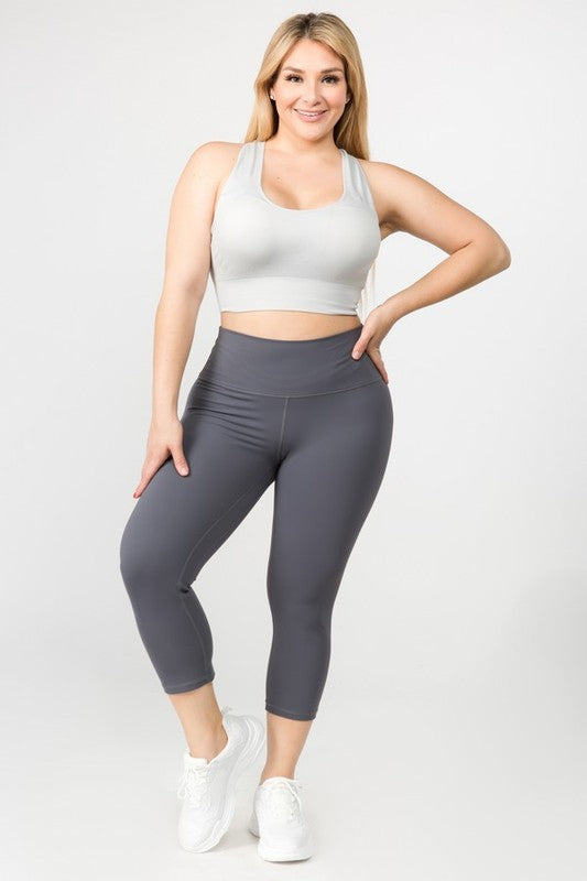 Charcoal high-rise capri leggings with a soft feel, wide waistband, and hidden pocket for essentials. Made with stretchy fabric.