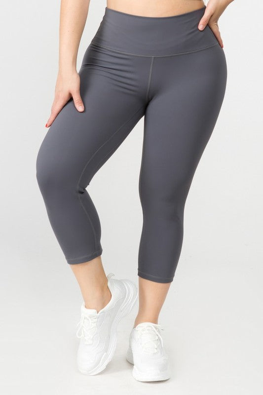 Charcoal high-rise capri leggings with a soft feel, wide waistband, and hidden pocket for essentials. Made with stretchy fabric.