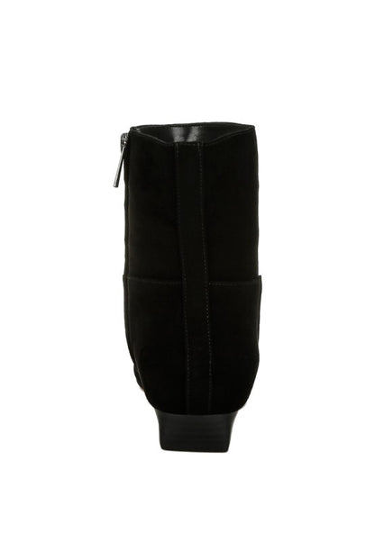 Back view of the black Hakra suede boot showcasing the flared low heel and sleek paneling detail.
