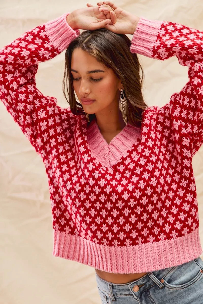 Chloe red pink pullover sweater with ribbed trim and geometric diamond print.