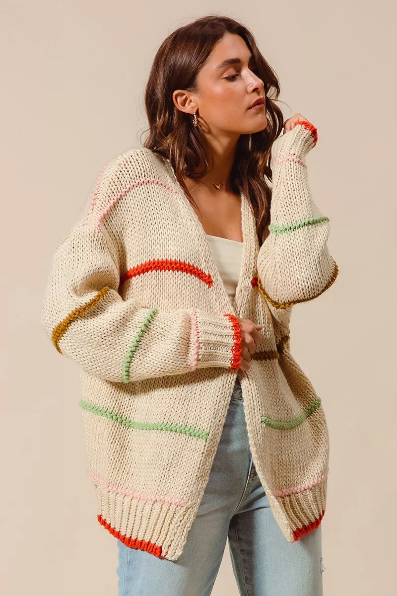 Angelina Cardigan side angle highlighting relaxed oversized fit and stripe accents.