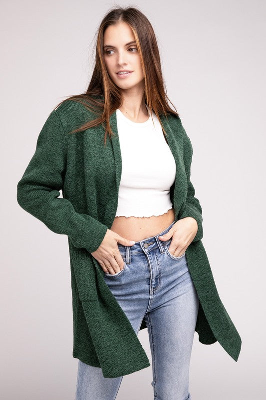 Dark Green sweater cardigan with long sleeves, front pockets, and a hooded neckline. 