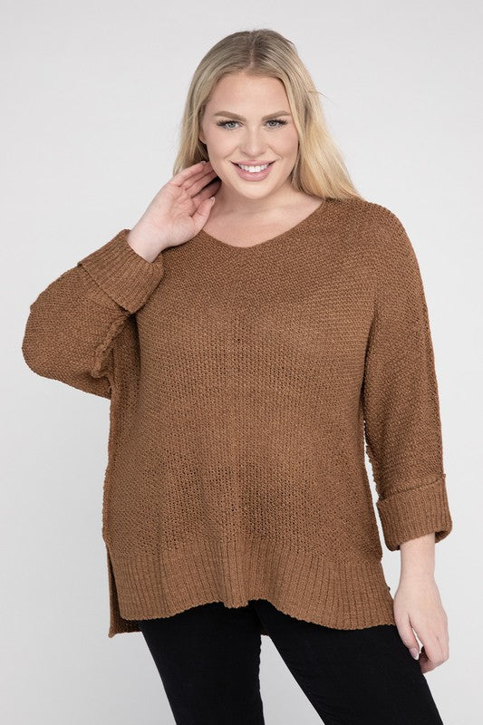 Coco plus size crew neck sweater with a loose fit, side slits, long sleeves, and a cozy knit fabric for warmth.