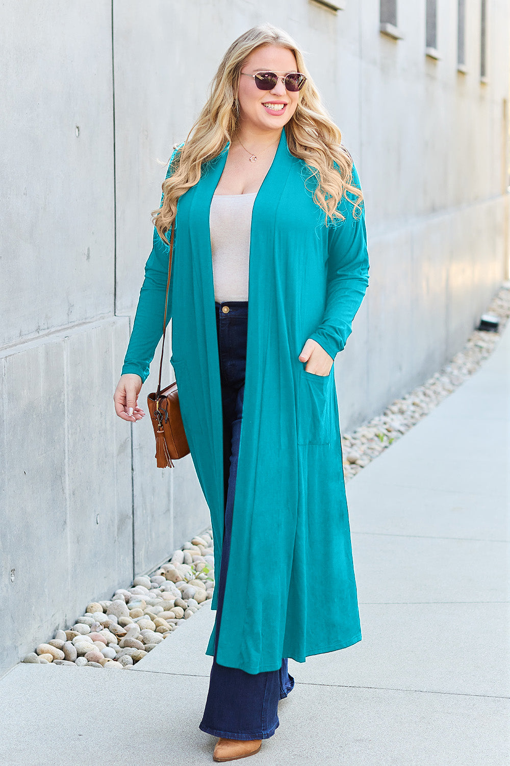 Sky Blue open-front long-sleeve cover-up with a flowy design and pockets, perfect for layering on breezy days.