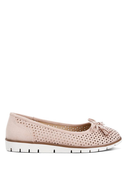Outside side view of blush Pacer vegan leather ballerina flats highlighting the perforated design and bow embellishment.