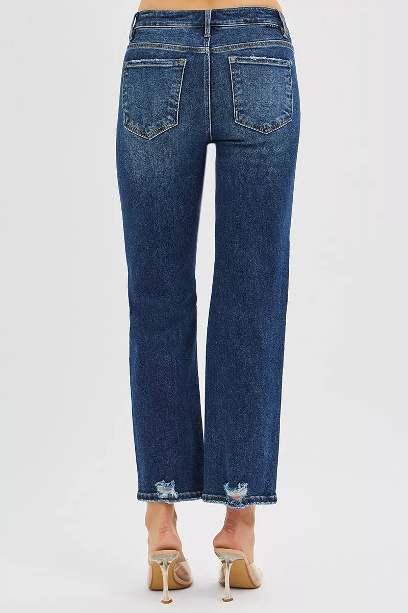 Back view of Jenna High Rise Crop Slim Straight Jeans with dark wash and subtle distressing.