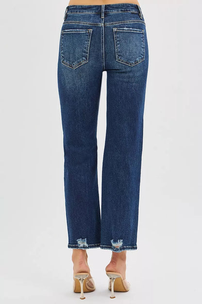 Back view of Jenna High Rise Crop Slim Straight Jeans with dark wash and subtle distressing.