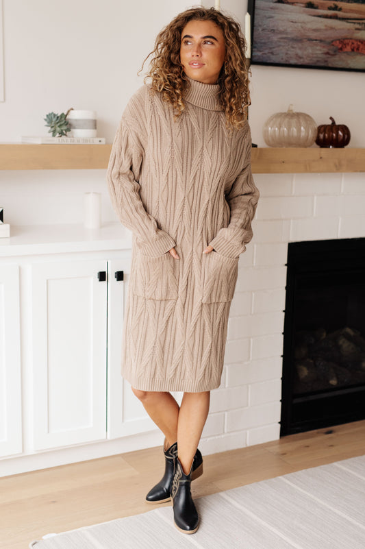Front view of Bunny Turtleneck Sweater Dress showing cozy cable knit and relaxed midi silhouette.