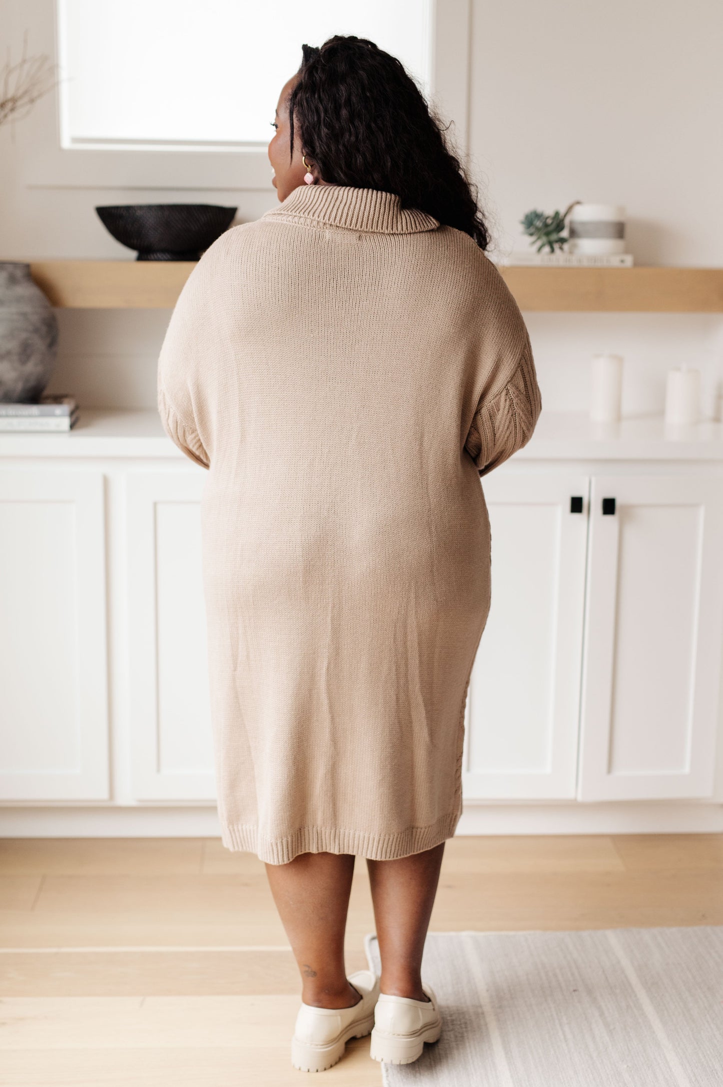 Back view of plus-size Bunny Turtleneck Sweater Dress with dropped shoulder sweater design.