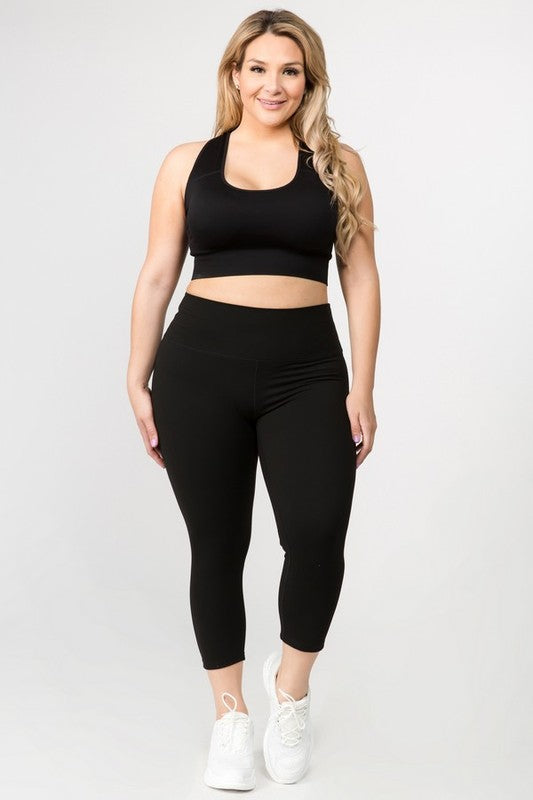 Black high-rise capri leggings with a soft feel, wide waistband, and hidden pocket for essentials. Made with stretchy fabric.