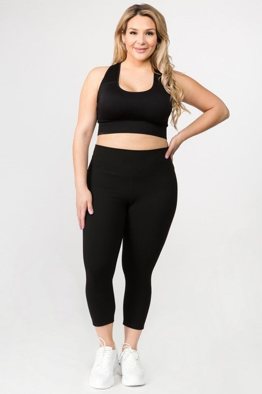 Black high-rise capri leggings with a soft feel, wide waistband, and hidden pocket for essentials. Made with stretchy fabric.