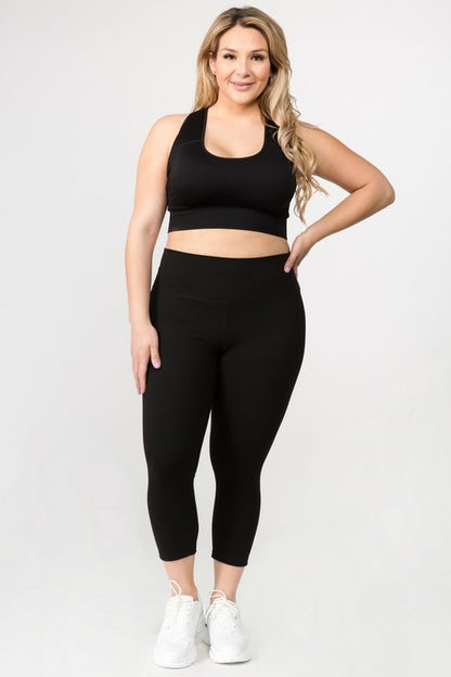 Black plus size Daiva Capri Leggings with wide waistband and 4-way stretch for comfort and movement.