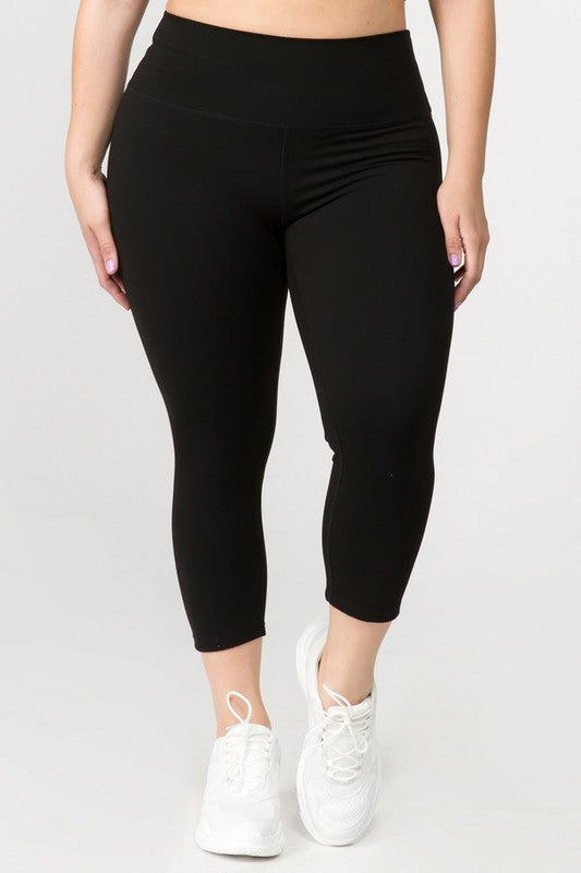 Black high-rise capri leggings with a soft feel, wide waistband, and hidden pocket for essentials. Made with stretchy fabric.