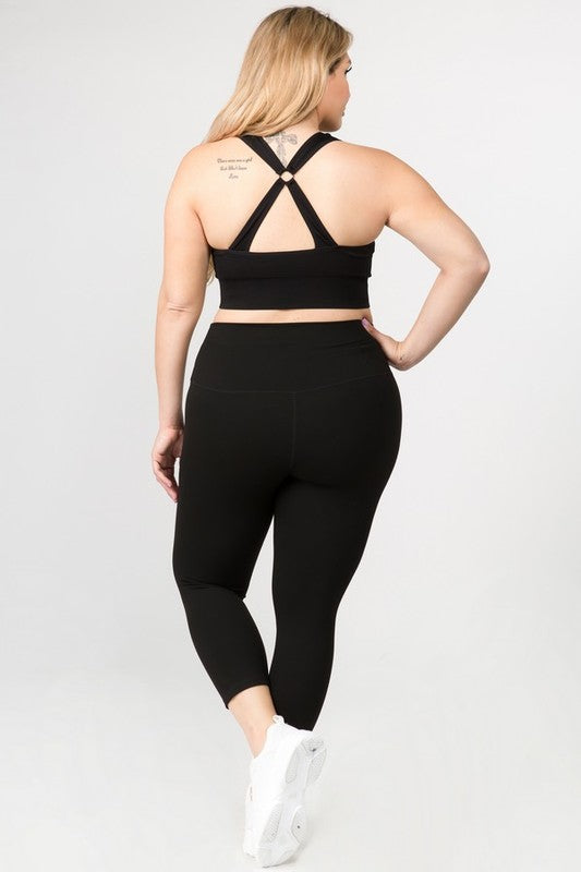 Black high-rise capri leggings with a soft feel, wide waistband, and hidden pocket for essentials. Made with stretchy fabric.