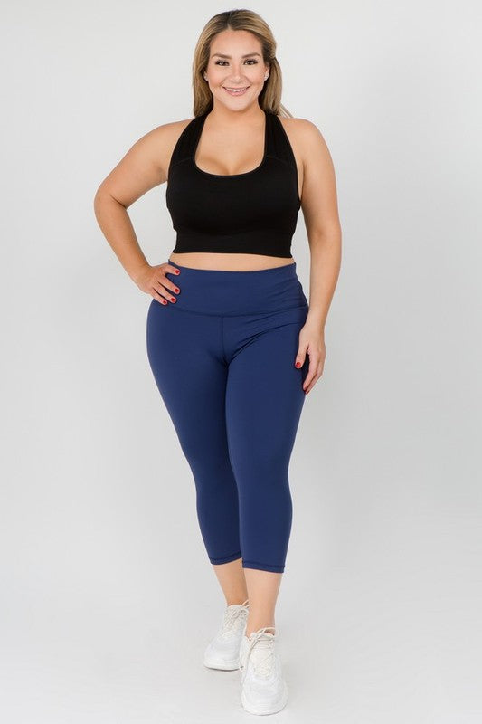 Navy high-rise capri leggings with a soft feel, wide waistband, and hidden pocket for essentials. Made with stretchy fabric.