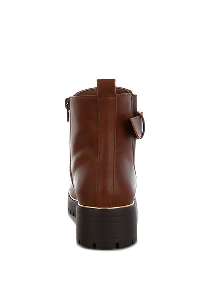 Back view of tan Antorin chunky buckle ankle boots with pull tabs and seam detail.
