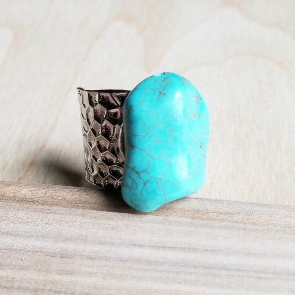 Chunky silver-plated cuff ring featuring a bold turquoise stone ranging from 25mm to 40mm, with an adjustable fit and handcrafted design.